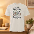 T-shirt with graphic of a charging battery and text "I'm Not Ignoring You, I'm Recharging."