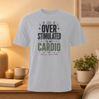White t-shirt with "Over Stimulated Is My Cardio" text.