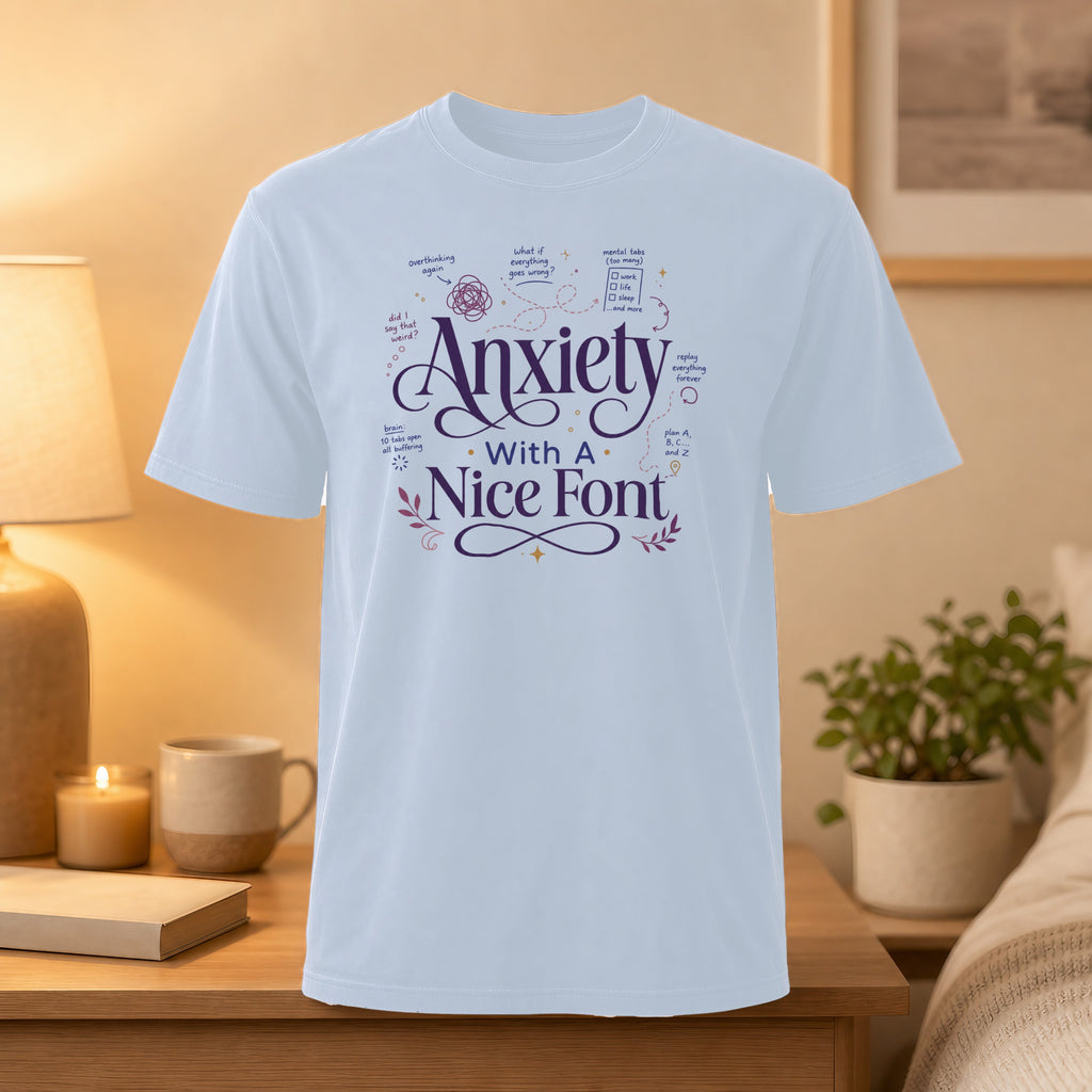White t-shirt with "Anxiety with a Nice Font" and mental health text.