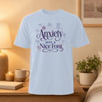 White t-shirt with "Anxiety with a Nice Font" and mental health text.