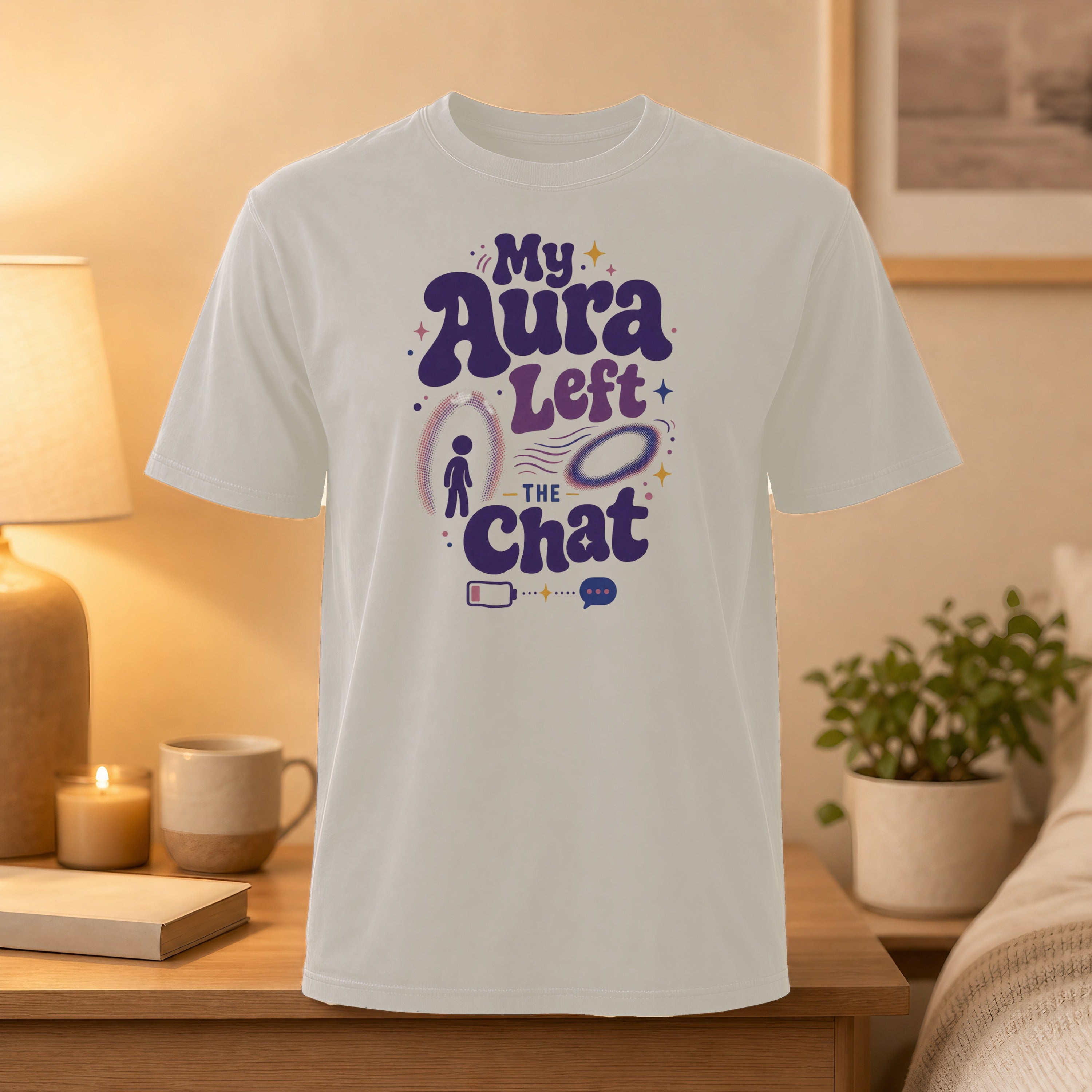 White t-shirt with "My Aura Left The Chat" graphic featuring a battery and speech bubble.