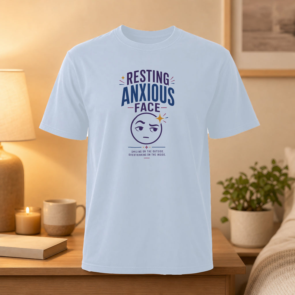 White t-shirt with "Resting Anxious Face" text and an emoji graphic.