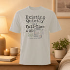 T-shirt with "Existing Quietly Is A Full-Time Job" and time sheet graphic.