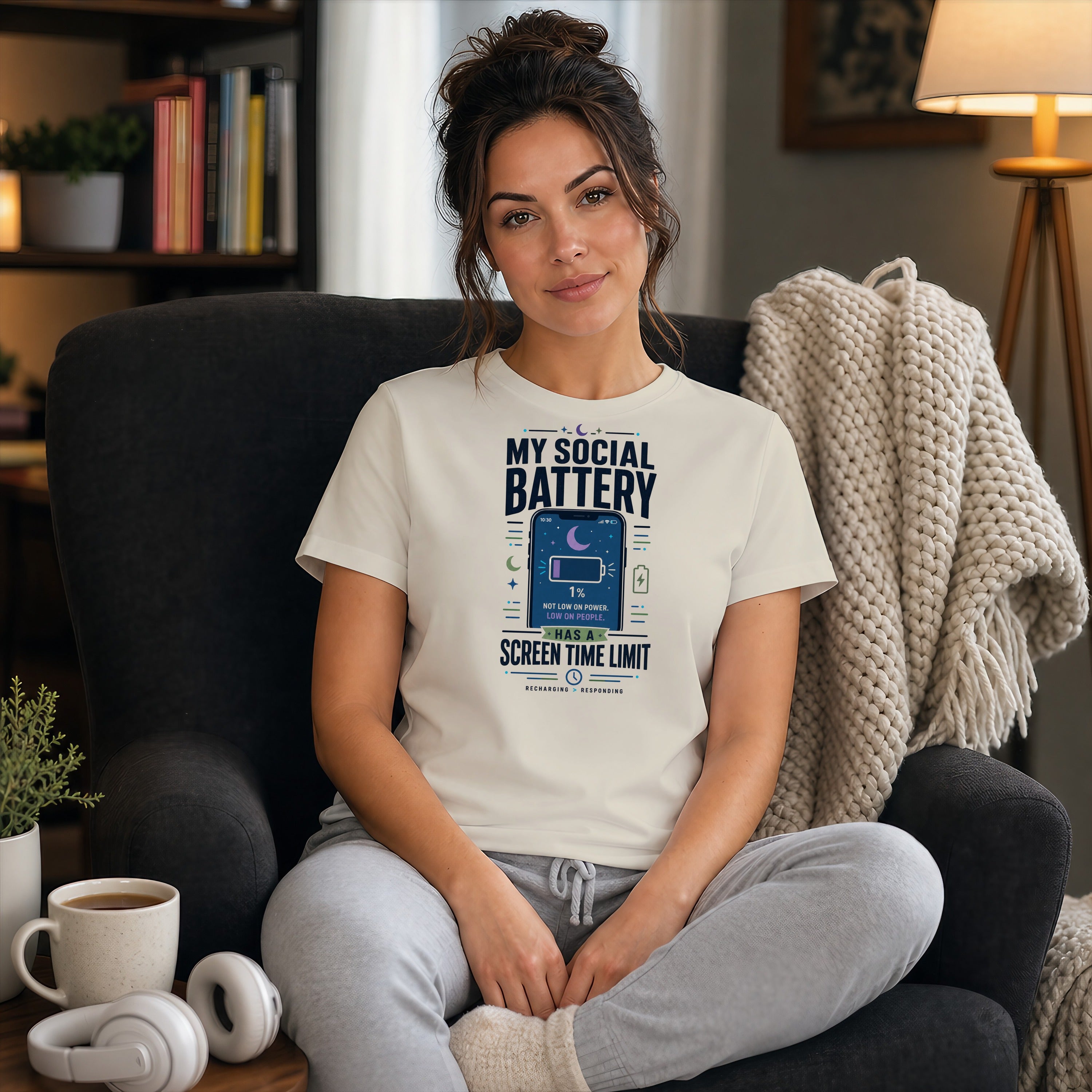 Woman wearing a white t-shirt with "MY SOCIAL BATTERY" graphic.