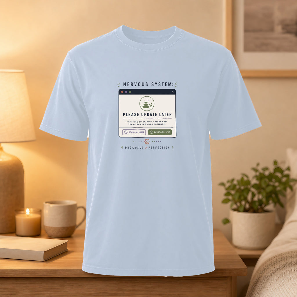 Light blue t-shirt with "Nervous System: Please Update Later" computer error message.
