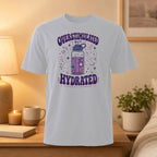 White t-shirt with "Overstimulated but Hydrated" graphic featuring a water bottle and stars.