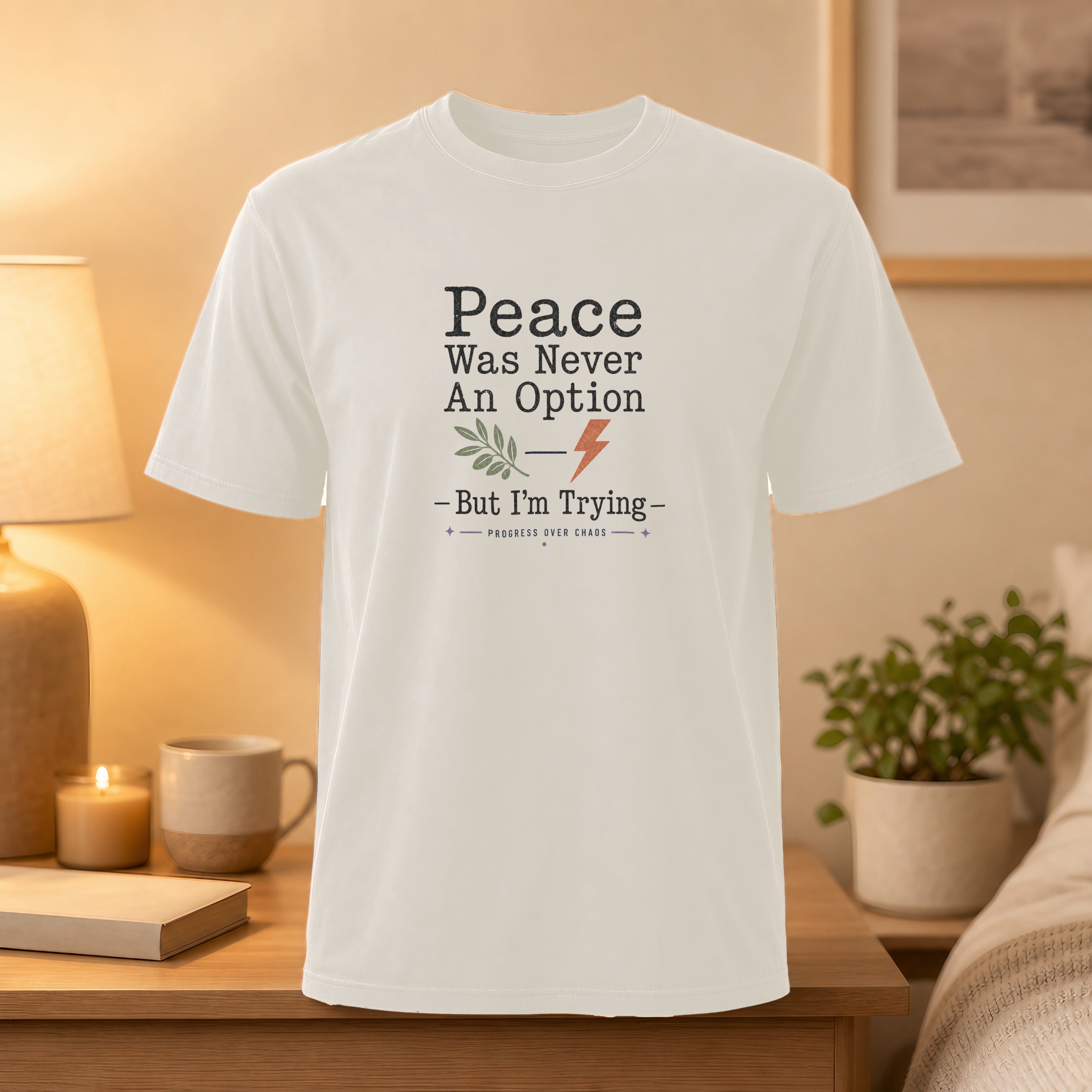 White t-shirt with text "Peace Was Never An Option - But I'm Trying" and lightning bolt.