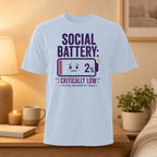 White t-shirt with "SOCIAL BATTERY: 2% CRITICALLY LOW" graphic.