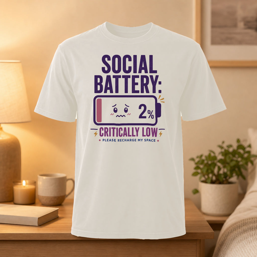 White t-shirt with "Social Battery: Critically Low 2%" and a battery icon.
