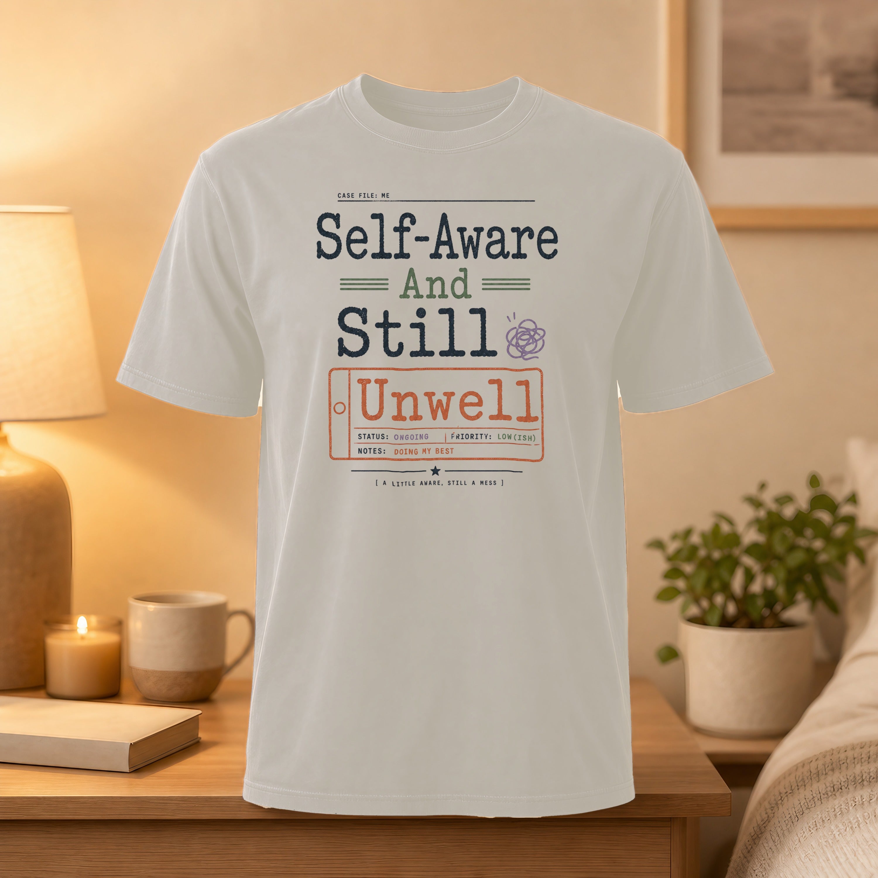 White t-shirt with "Self-Aware And Still Unwell" text and case file details.