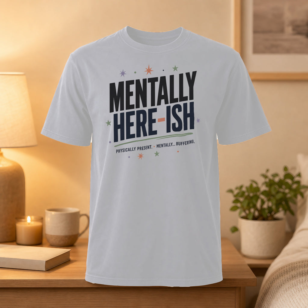 White t-shirt with "MENTALLY HERE-ISH PHYSICALLY... BUFFERING." text.