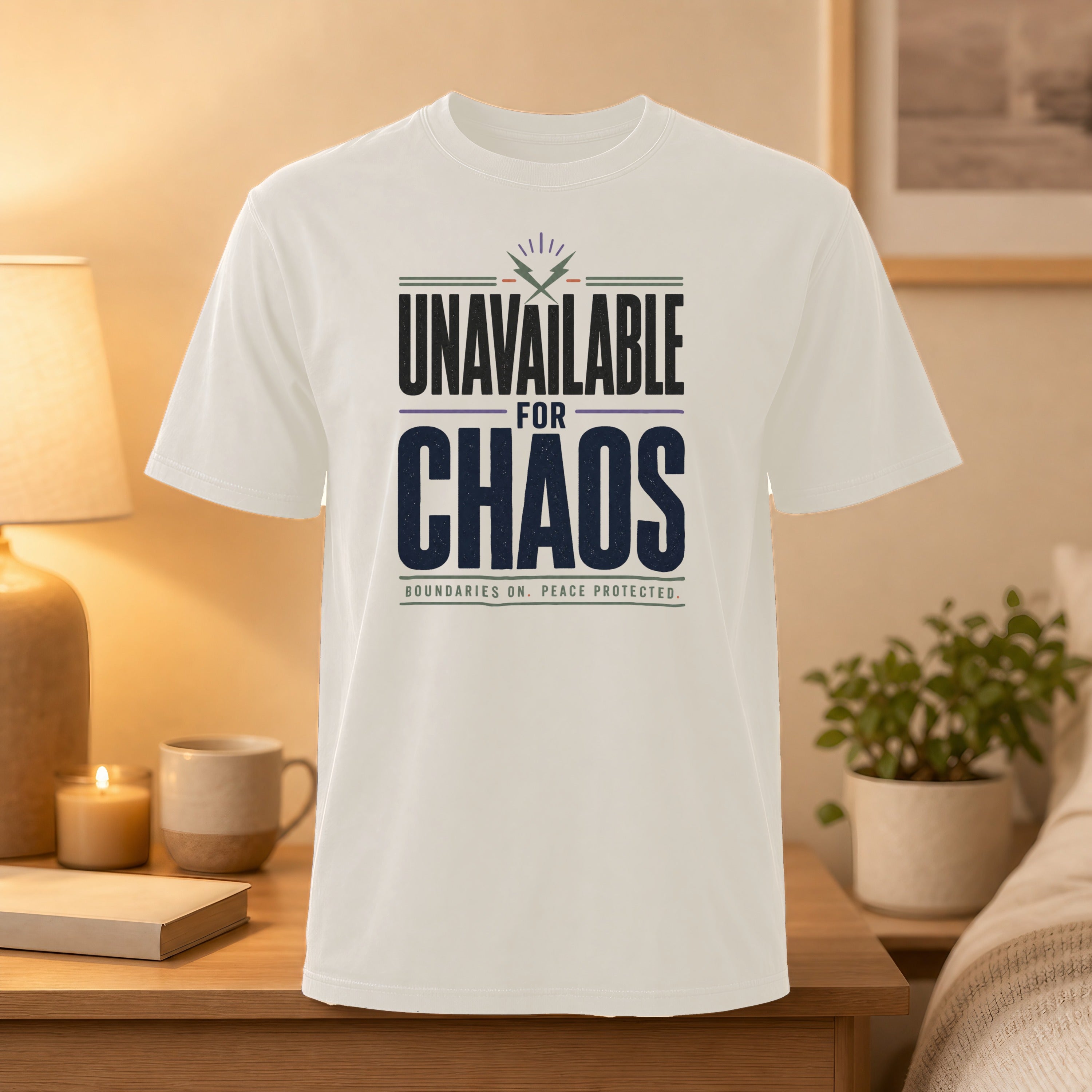 White t-shirt with "UNAVAILABLE FOR CHAOS" and "BOUNDARIES ON. PEACE PROTECTED." text.