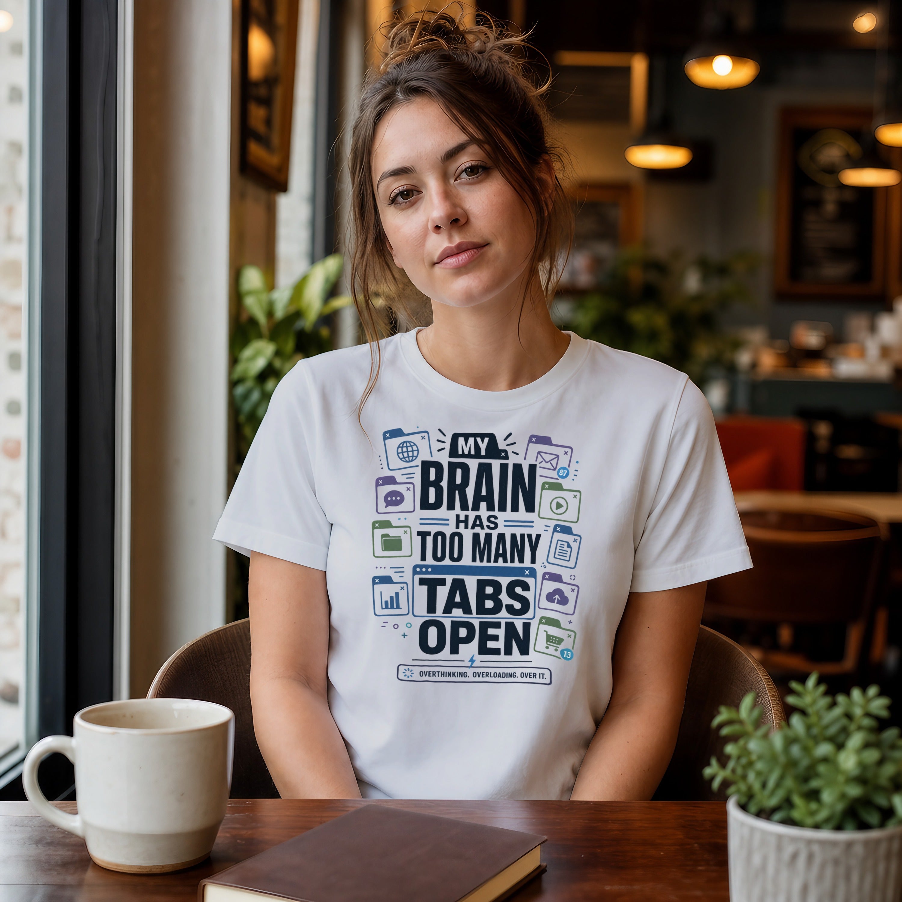 Woman wearing a white t-shirt with "MY BRAIN HAS TOO MANY TABS OPEN" text.