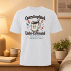 White t-shirt with "Overstimulated, Under-Caffeinated" and lightning bolt coffee mug graphic.