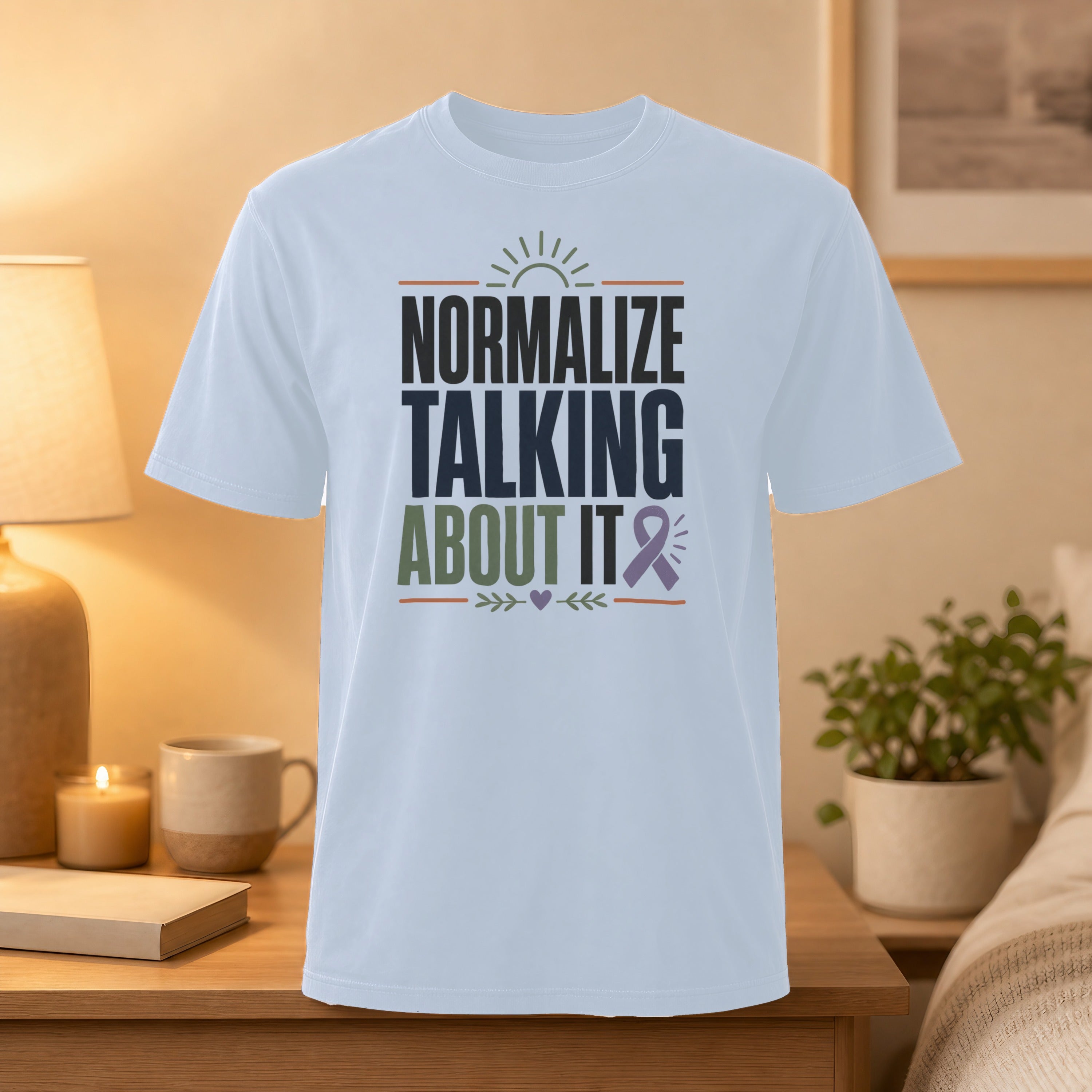 White t-shirt with "NORMALIZE TALKING ABOUT IT" text and a purple ribbon.