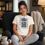 Woman wearing a t-shirt that says "My brain has too many tabs open".