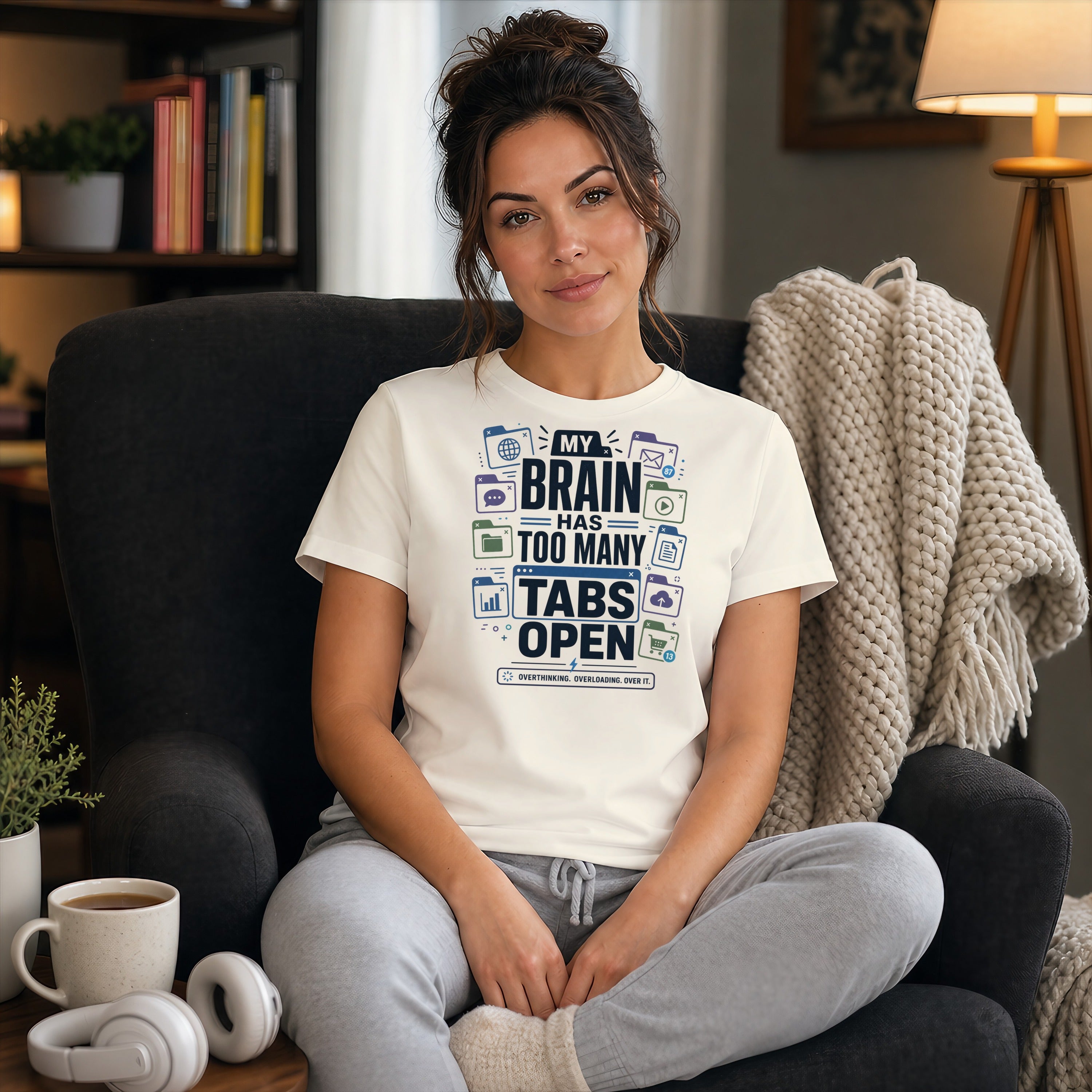 Woman wearing a t-shirt that says "My brain has too many tabs open".