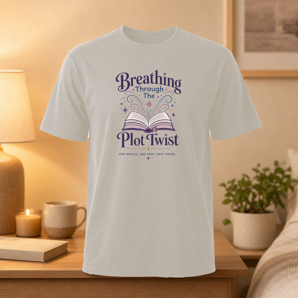 Light grey t-shirt with "Breathing Through the Plot Twist" book design.