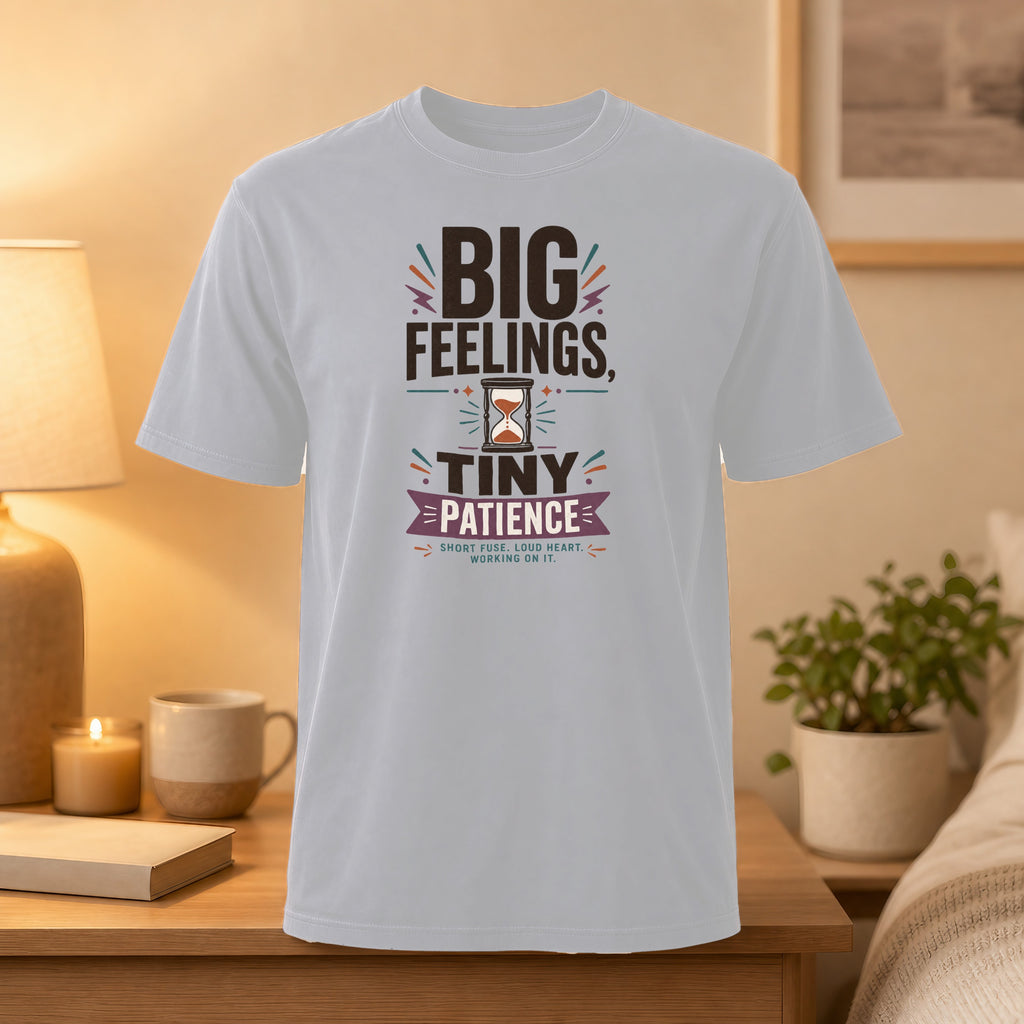 White t-shirt with "BIG FEELINGS, TINY PATIENCE" text and hourglass graphic.
