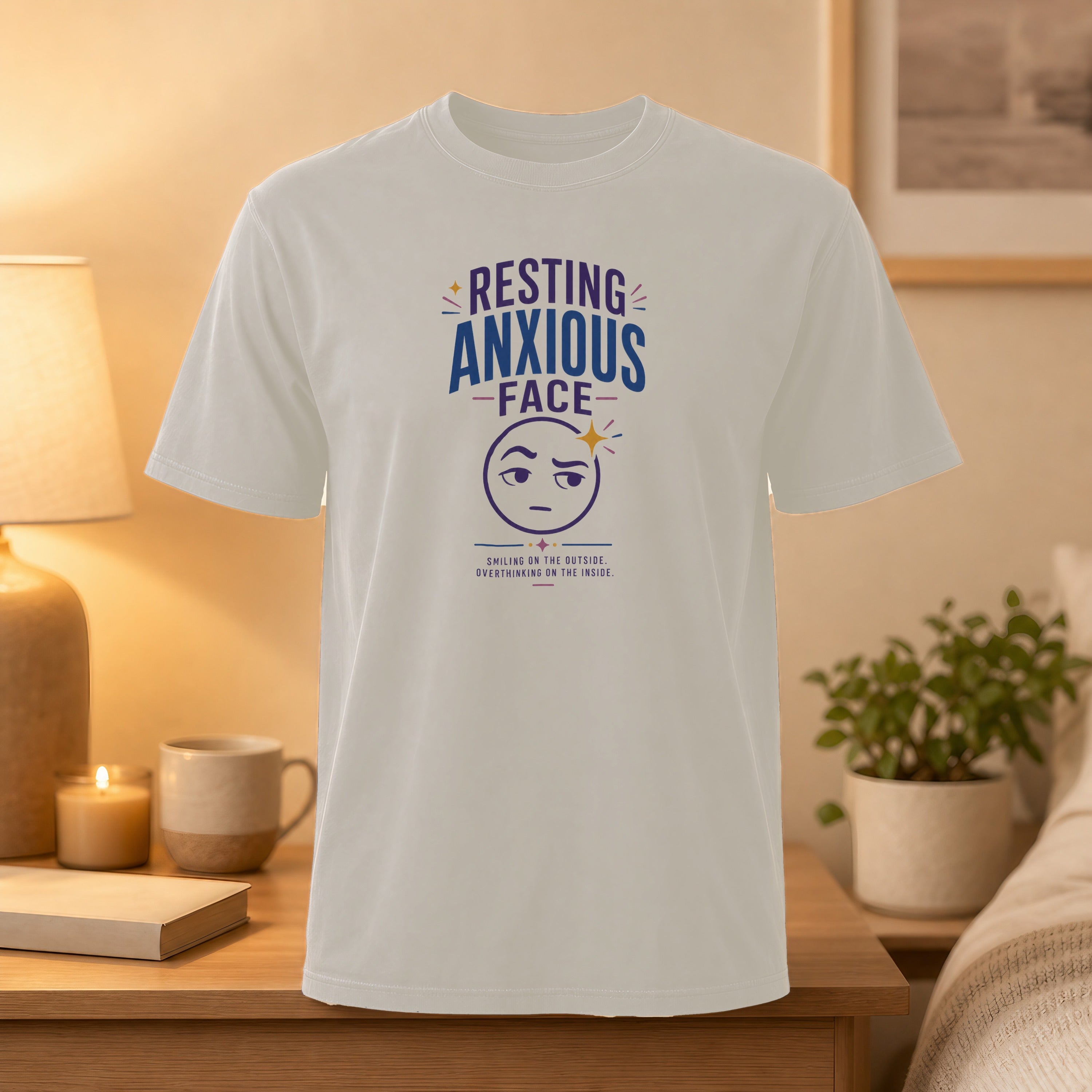 White t-shirt with "Resting Anxious Face" graphic and cartoon emoji.