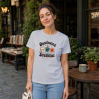 Woman wearing a white t-shirt with "Overstimulated Since Breakfast" text and graphic.