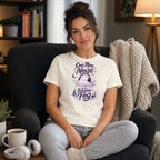 Woman wearing a cream t-shirt with "One More Noise And I Become Fog" text and cloud graphic.