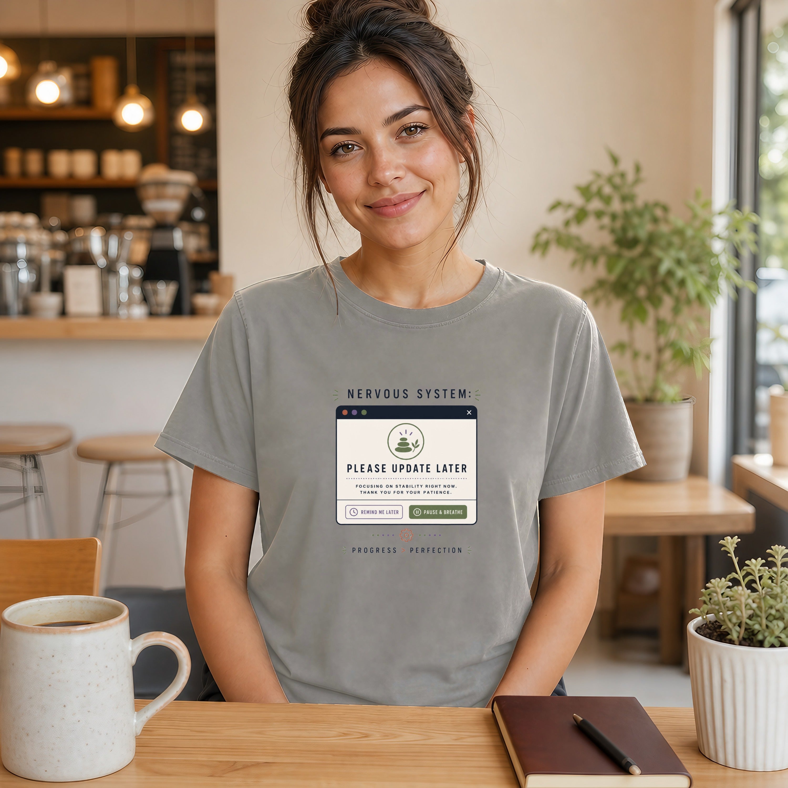 Woman in t-shirt with "Nervous System: Please Update Later" text.