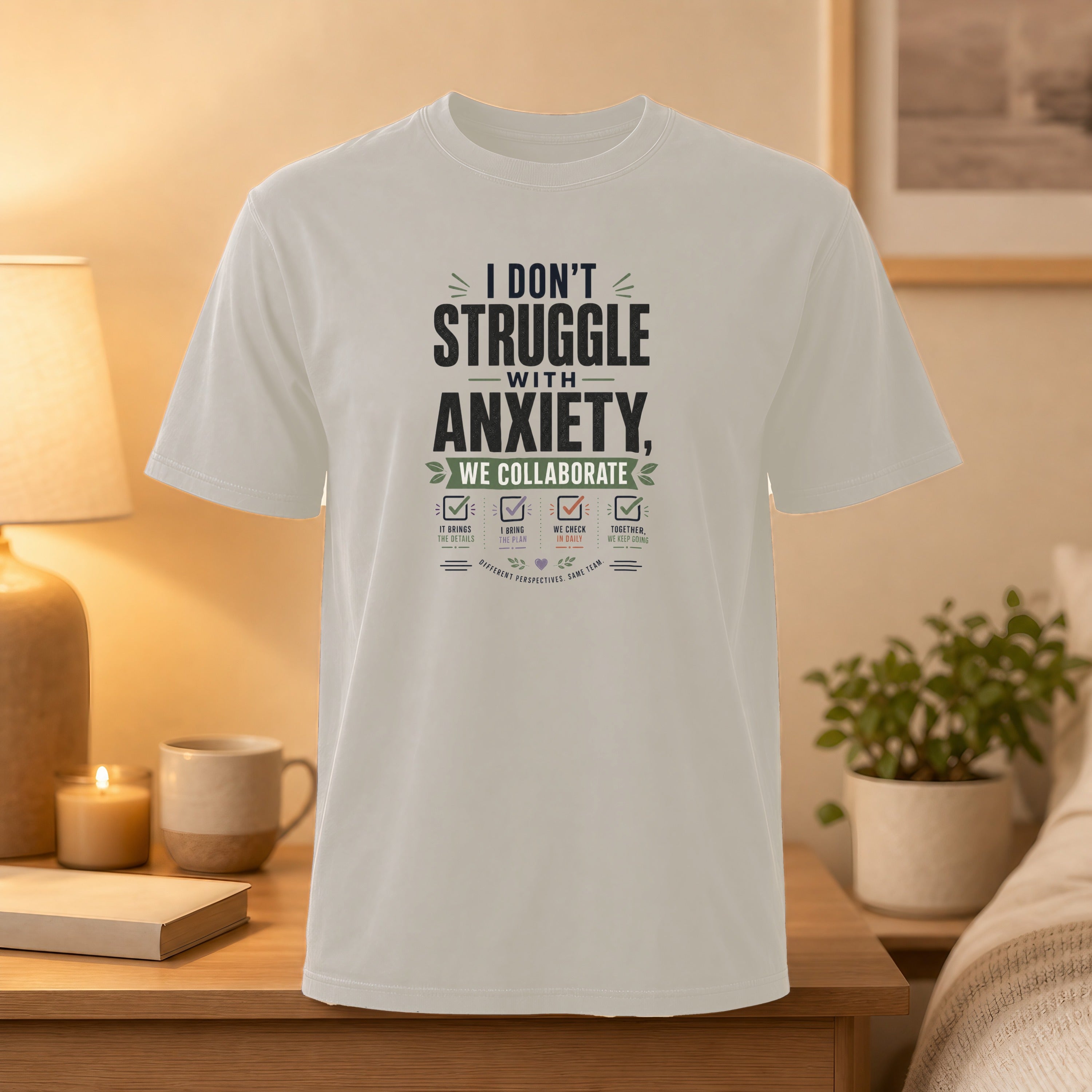 White t-shirt with text "I Don't Struggle With Anxiety, We Collaborate."