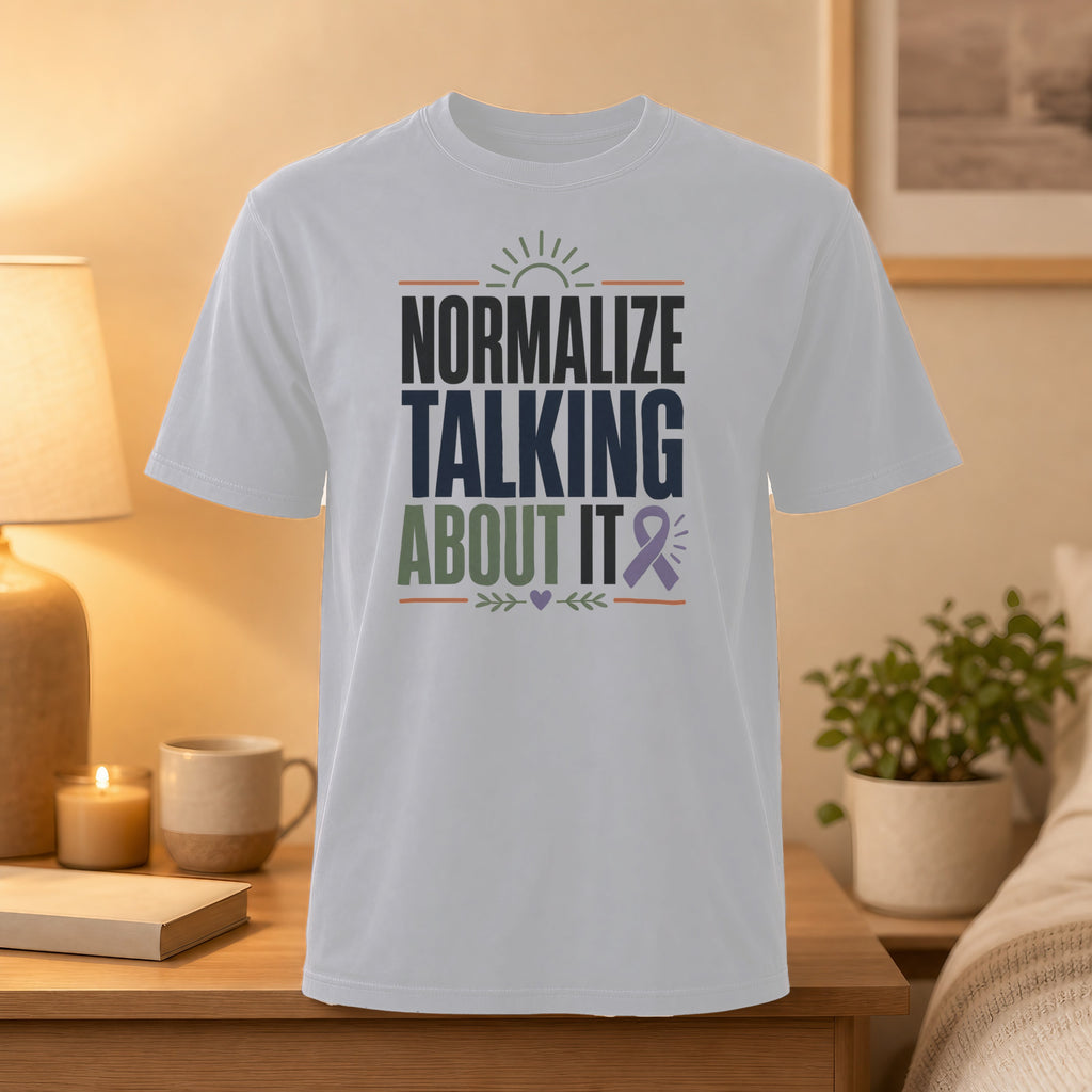 White t-shirt with "Normalize Talking About It" text and a purple ribbon.