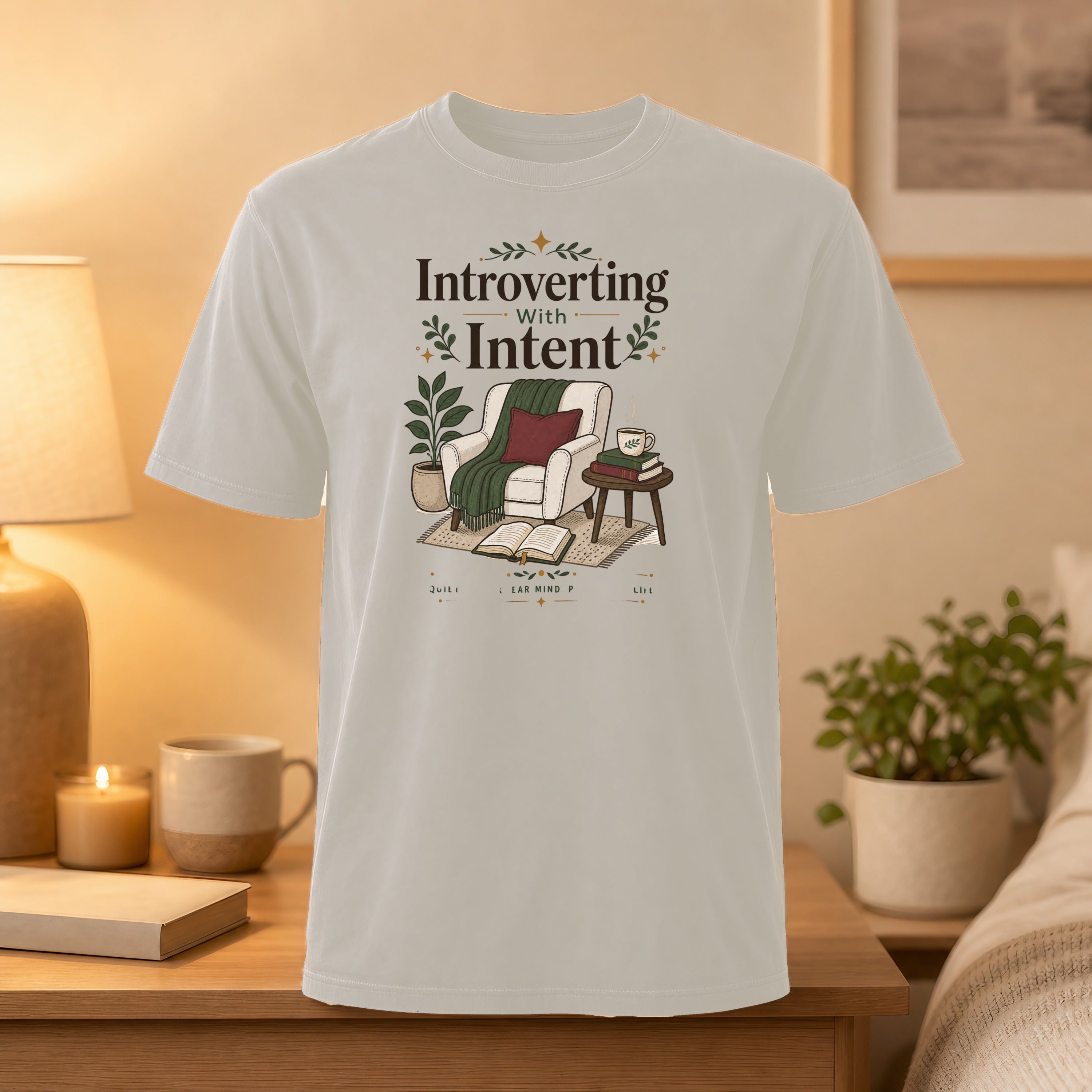 T-shirt with "Introverting with Intent" text and a cozy chair scene.