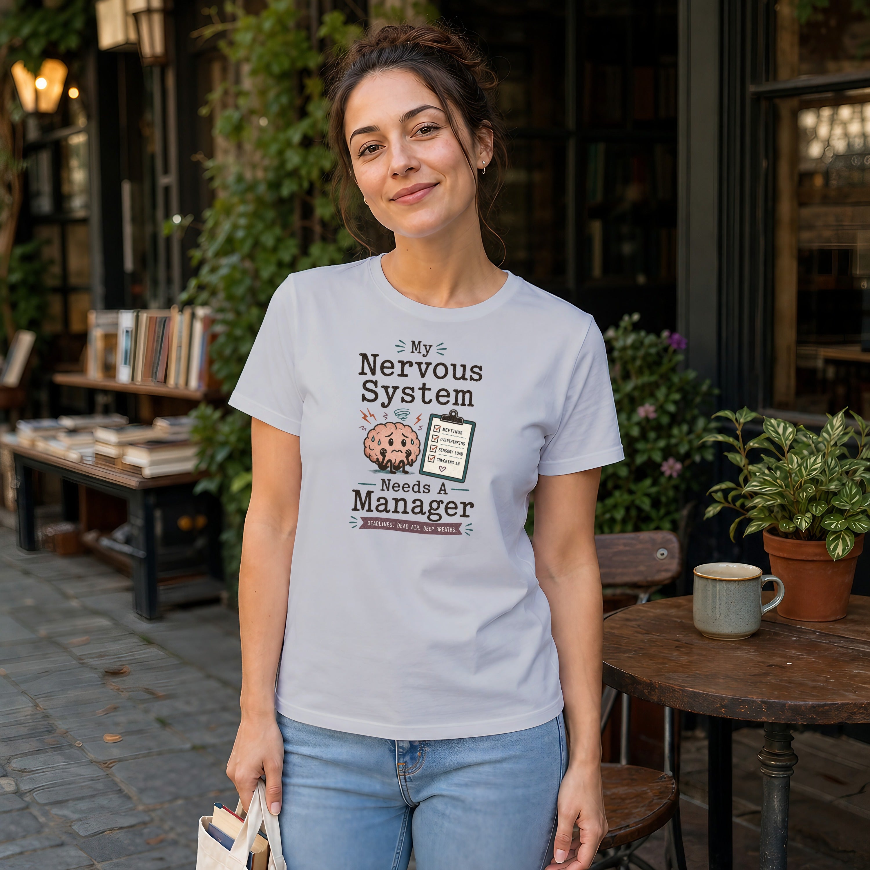 White t-shirt with "My Nervous System Needs A Manager" and checklist graphic.