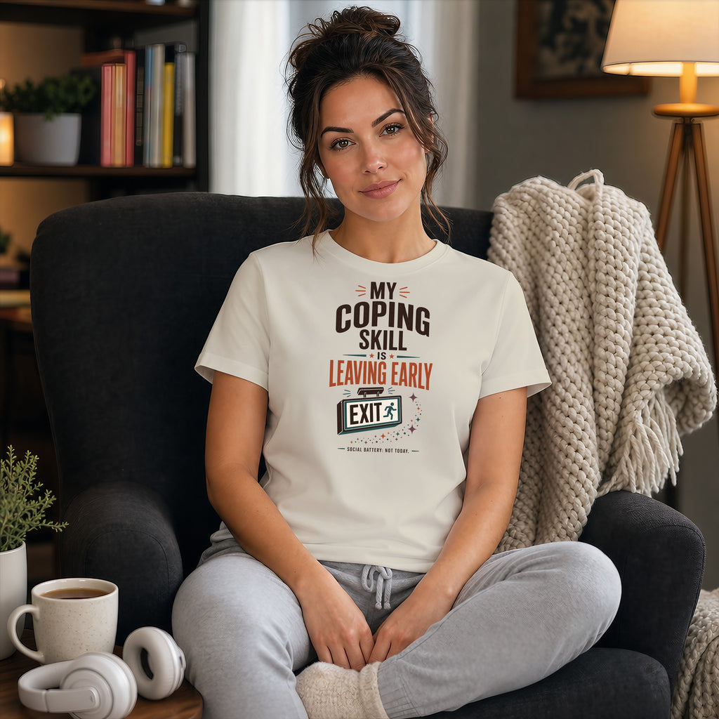 Woman sitting in a chair wearing a t-shirt that reads "My coping skill is leaving early."