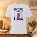 White t-shirt with "Overstimulated But Hydrated" text and cartoon water bottle.