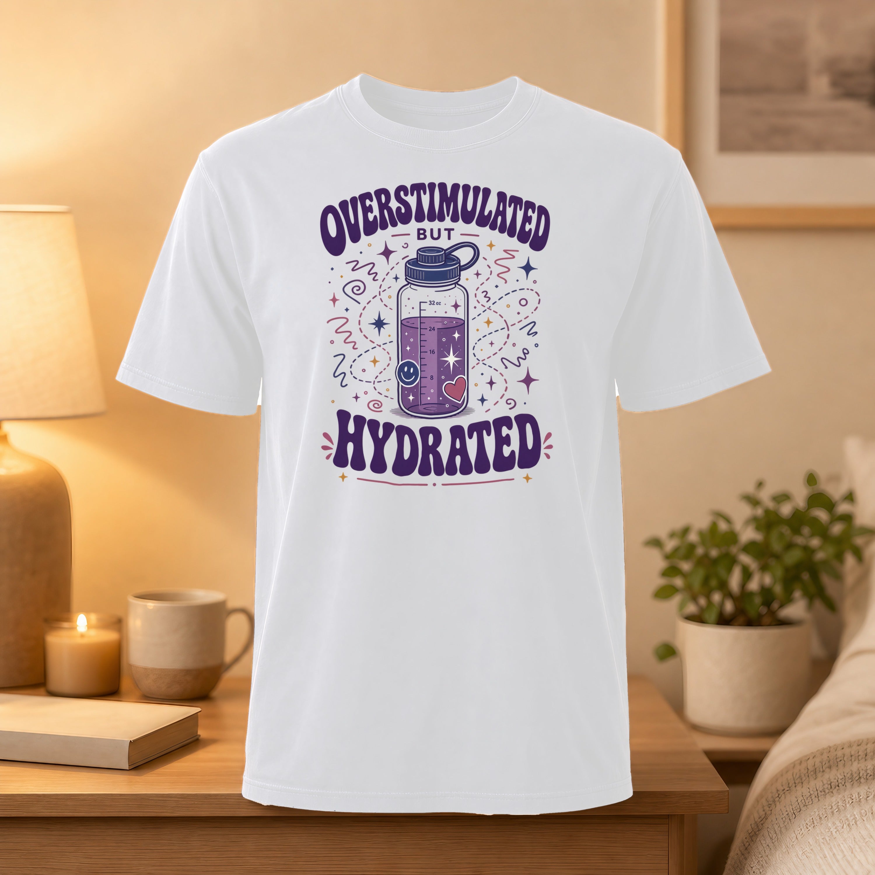 White t-shirt with "Overstimulated But Hydrated" text and cartoon water bottle.
