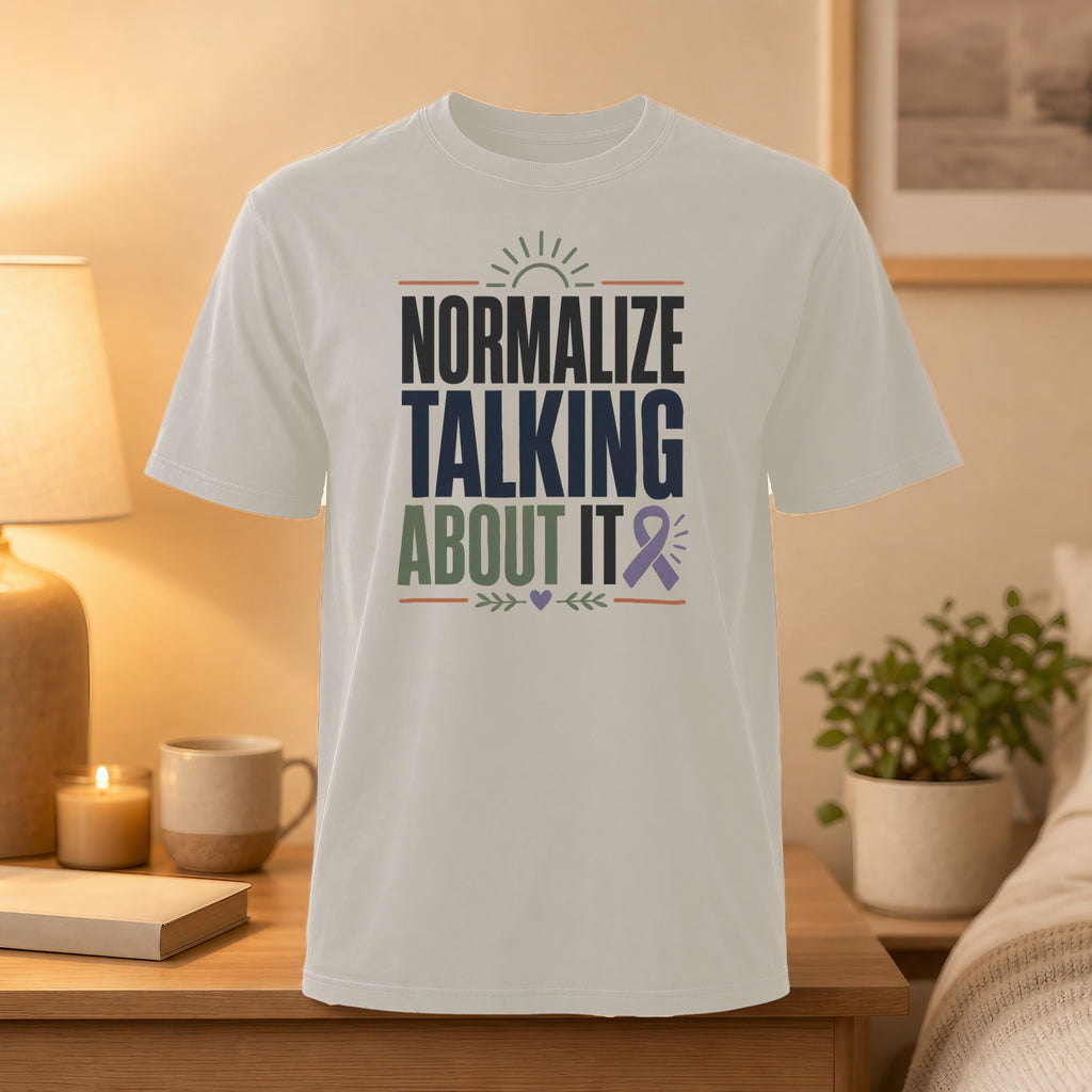 White t-shirt with "Normalize Talking About It" and purple ribbon graphic.