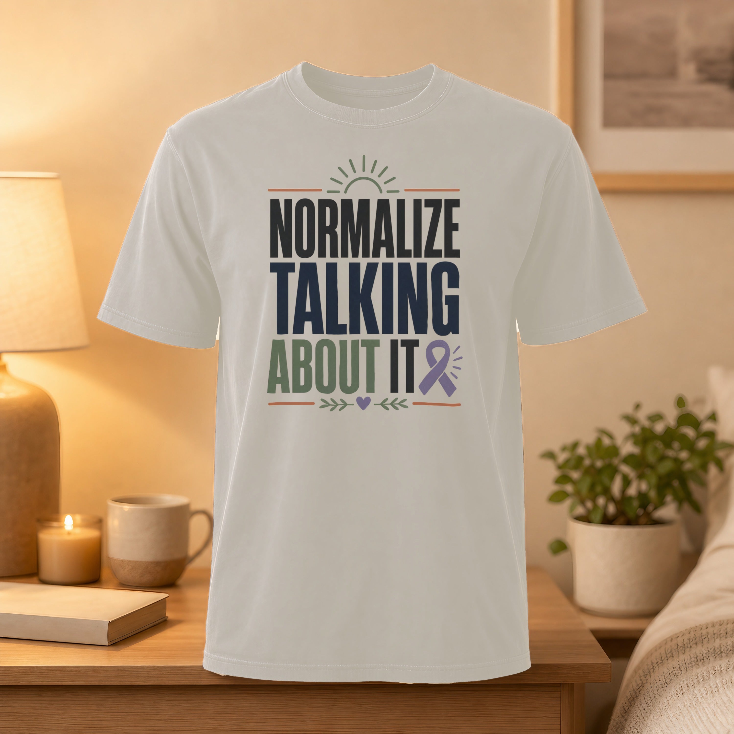 White t-shirt with "Normalize Talking About It" and purple ribbon graphic.
