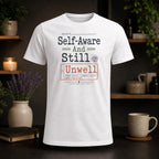 White t-shirt with "Self-Aware And Still Unwell" text, status ongoing, priority lowish.