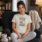 Woman in cream t-shirt with "My Nervous System Needs a Manager" text and checklist.