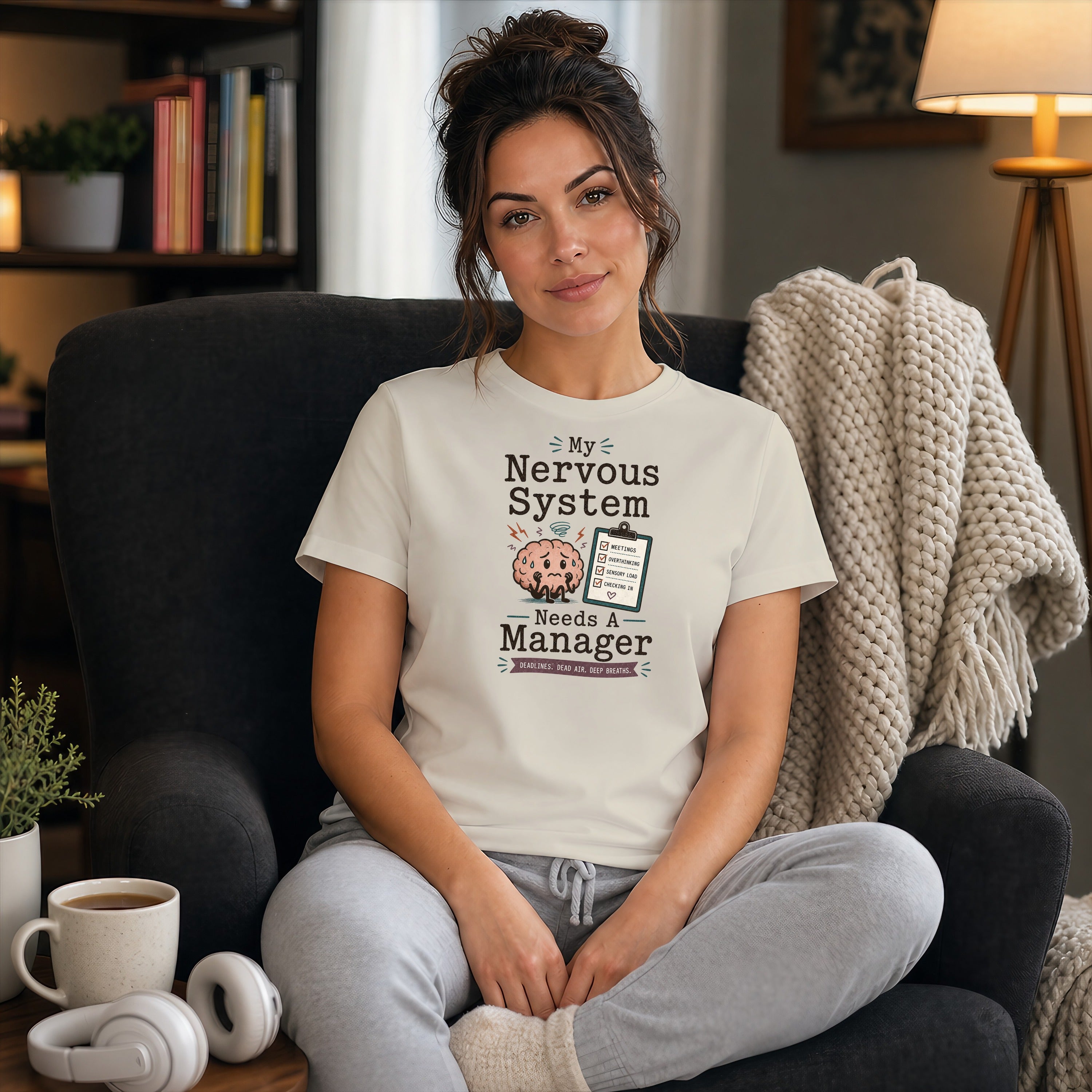 Woman in cream t-shirt with "My Nervous System Needs a Manager" text and checklist.