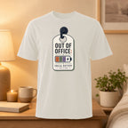 White t-shirt with "Out of Office: Social Battery" graphic on a tag.