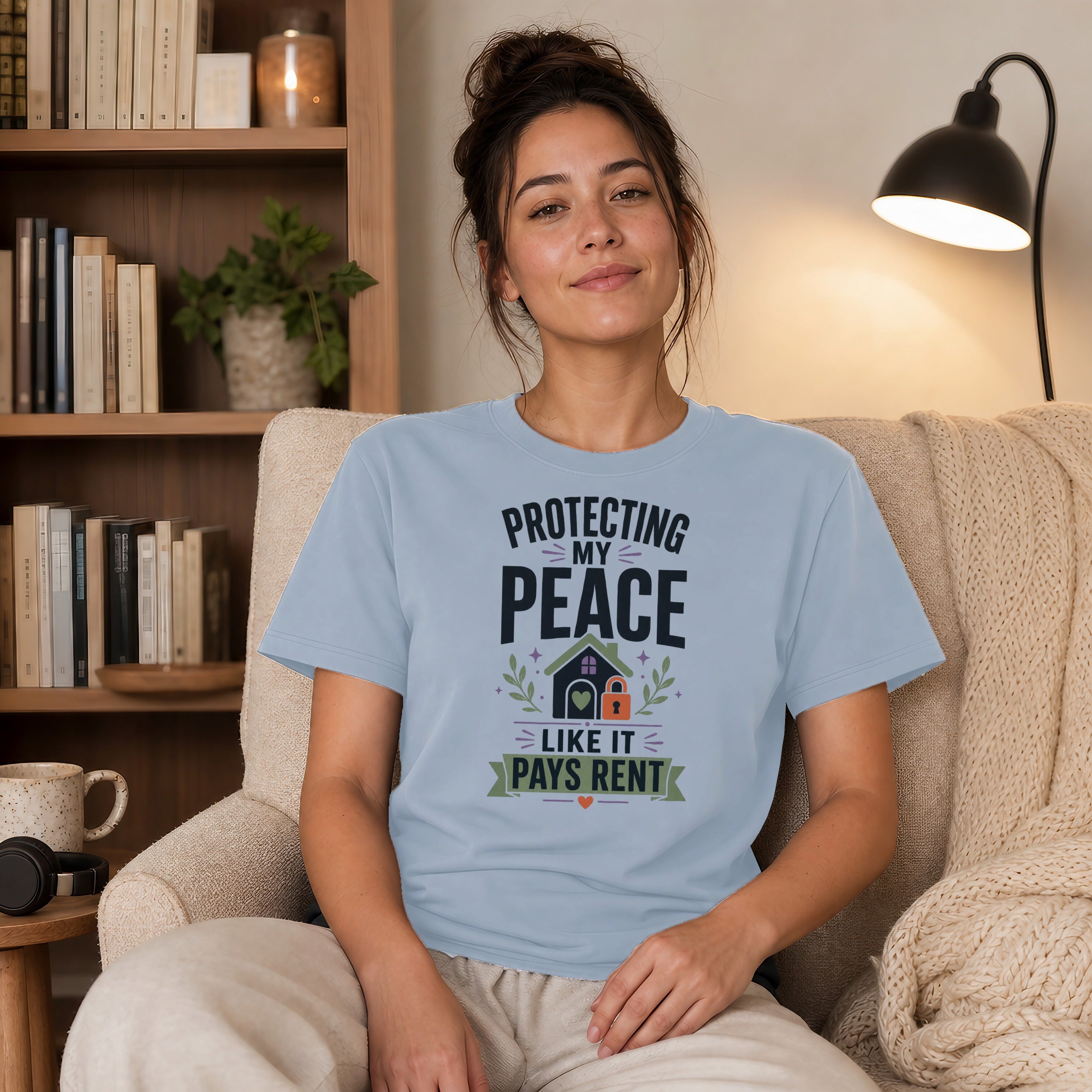 Light blue t-shirt with "Protecting My Peace" graphic including a house and lock.