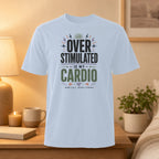 White t-shirt with "OVER STIMULATED IS MY CARDIO" text.