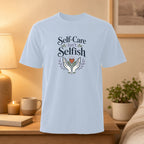 Light blue t-shirt with "Self-Care Isn't Selfish" text and a heart design.