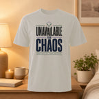 White t-shirt with "UNAVAILABLE FOR CHAOS" text.
