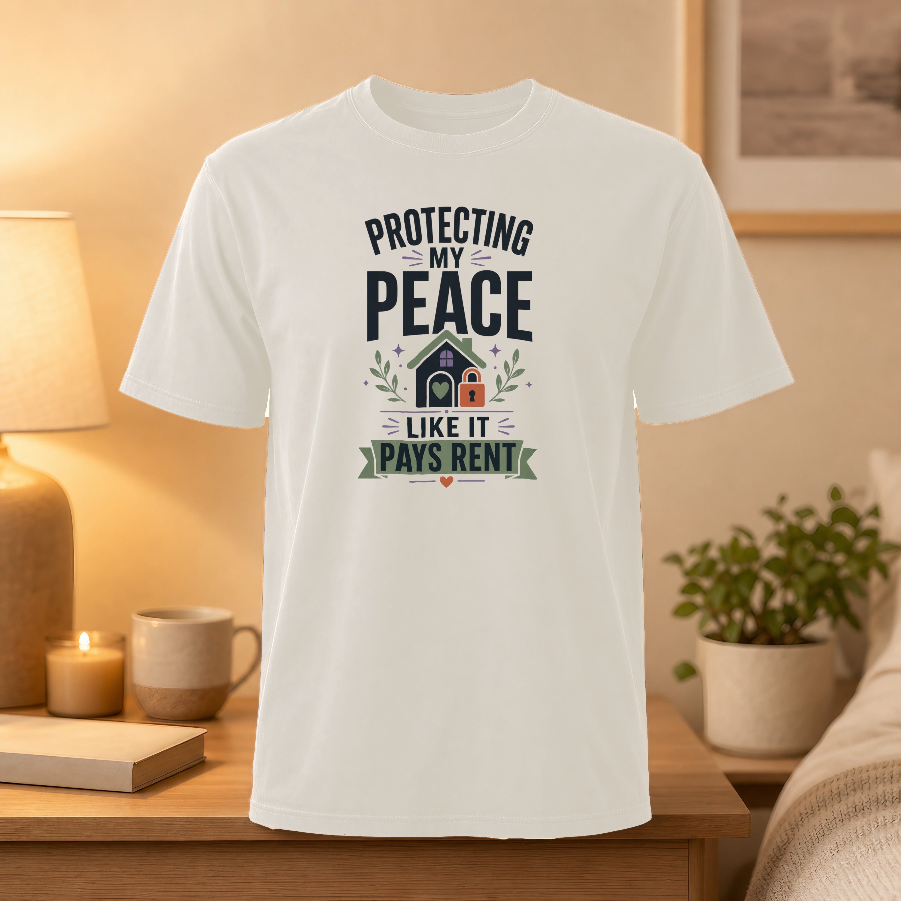 White t-shirt with "Protecting my peace like it pays rent" text and house graphic.