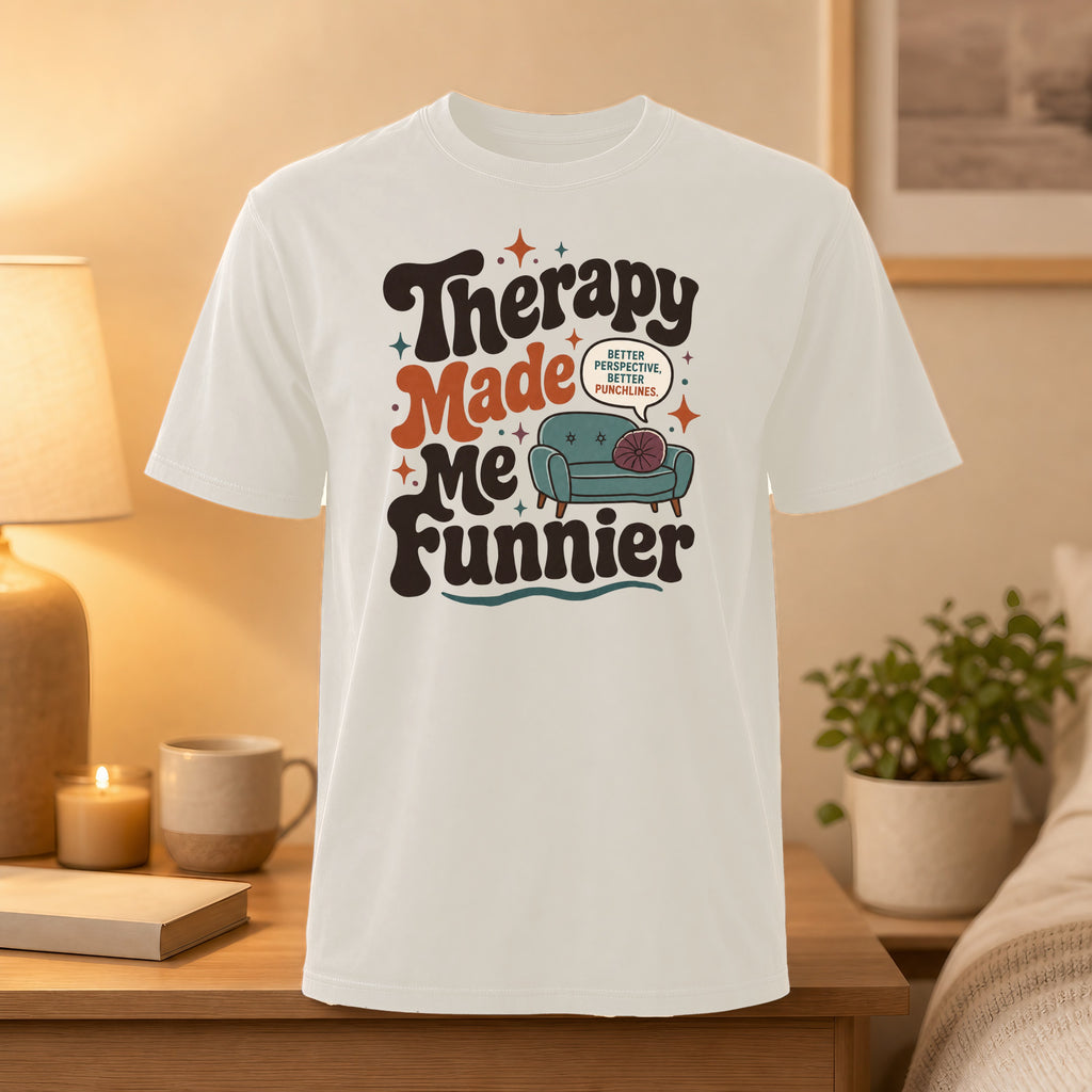 White t-shirt with "Therapy Made Me Funnier" graphic and couch illustration.