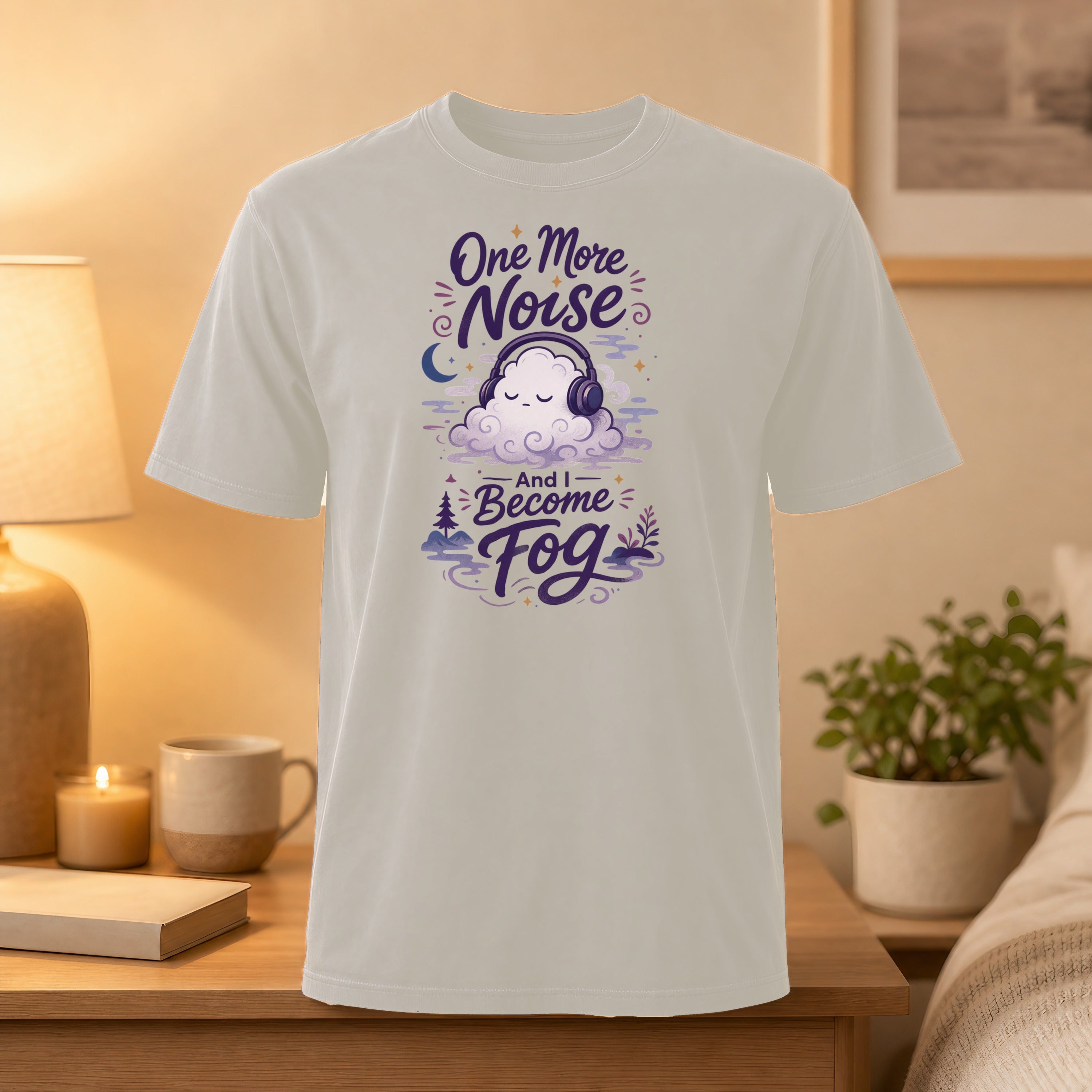T-shirt with purple text "One More Noise And I Become Fog" and cloud headphones graphic.
